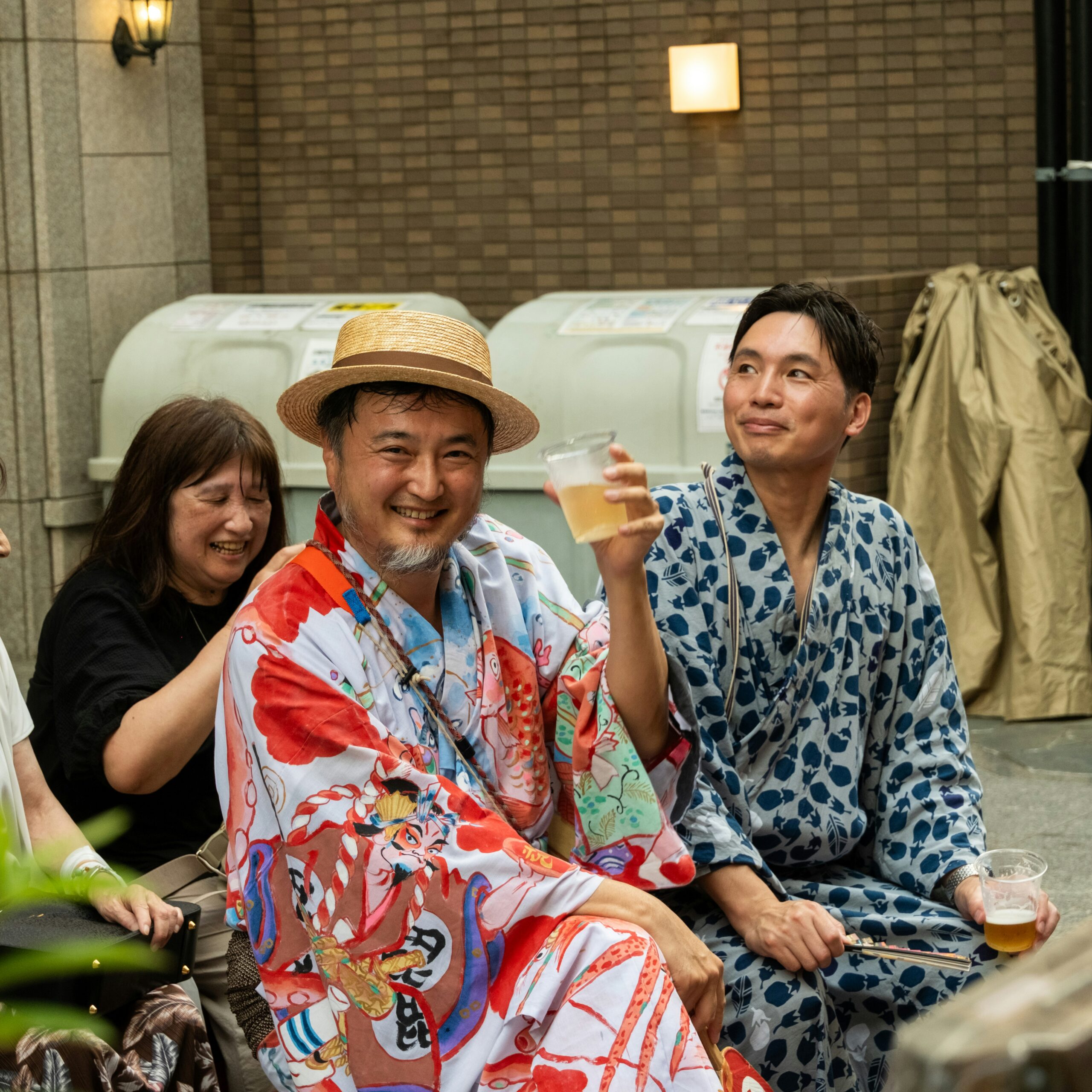 Two members of the Georgia and Japan delegation grinning in a selfie on the tour bus