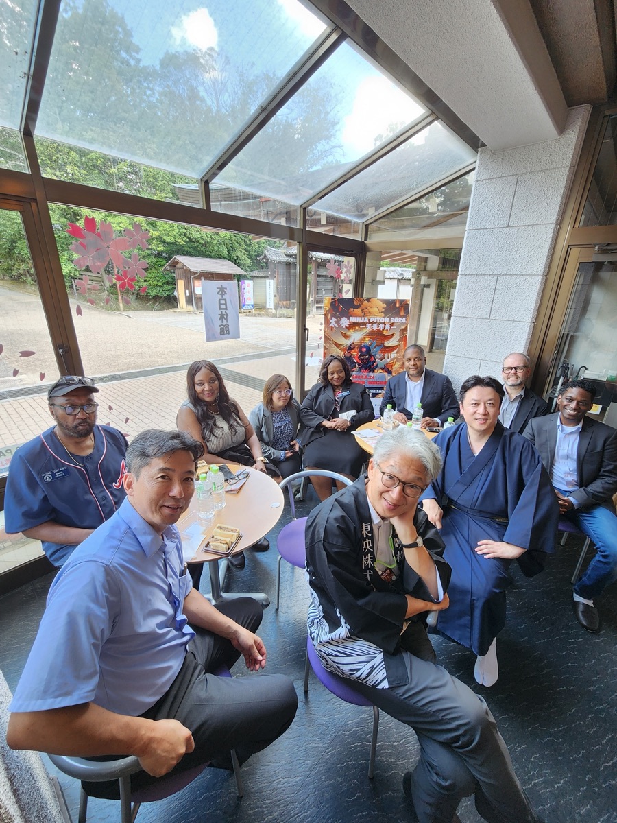 Georgia and Japan delegates around a table at a creators' pitch session in Japan